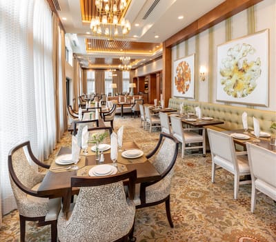Elegant dining room setup with tables and chairs