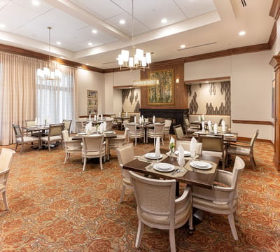 Bright dining room setup with tables and chairs