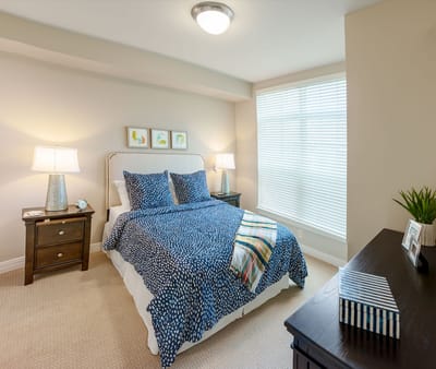A well-furnished private room in a senior living facility