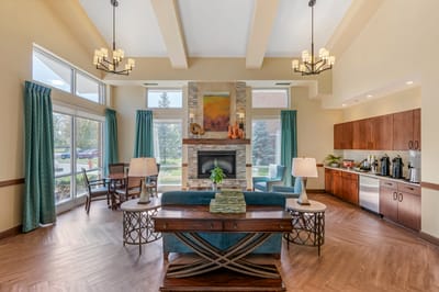 Bright common area with seating and kitchenette