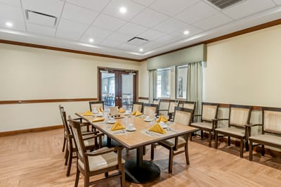 Dining room setup with place settings and decorations