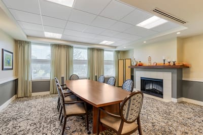 Bright and modern activity room with a large table