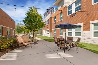Outdoor seating area with garden and pathways