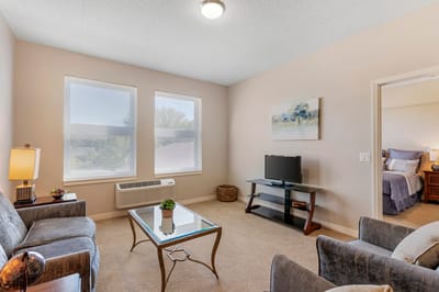 Bright interior of a resident's room with seating area