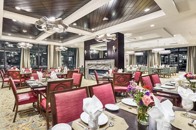 Elegant dining room with tables set for a meal