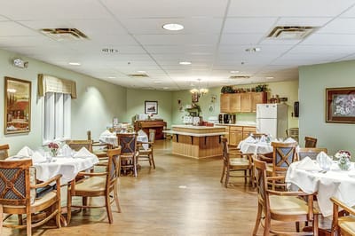 Dining area with decorated tables and a piano