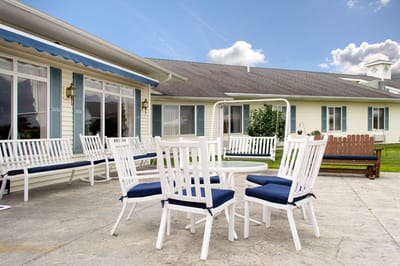 Outdoor seating area with tables and chairs