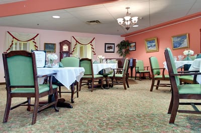Dining area with green chairs and tables