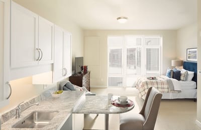 A bright and airy resident room with a kitchenette
