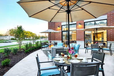 Outdoor dining area with tables and umbrellas