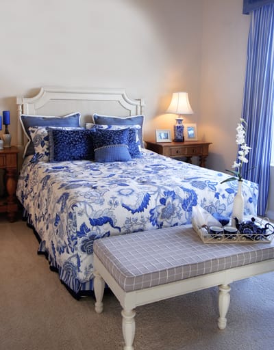 A beautifully decorated bedroom in a senior living facility