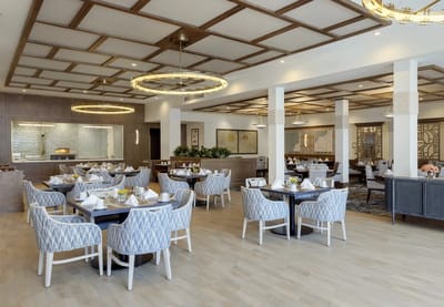 Elegant dining room with tables set for meals