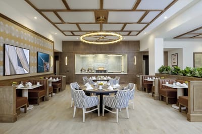 Elegant dining room with tables set for residents
