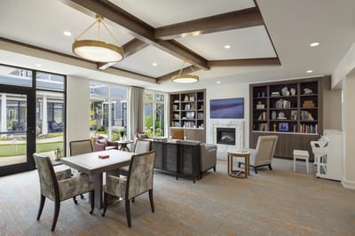 Bright common area with seating and bookshelves