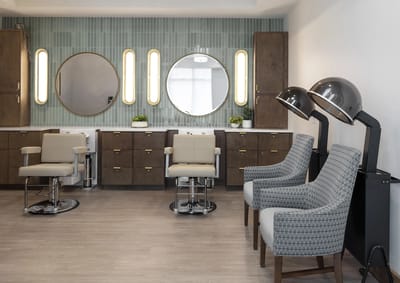 Interior view of a salon with styling chairs and mirrors