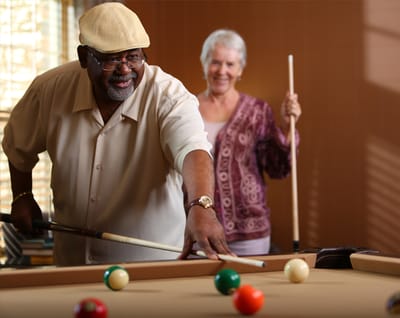 Residents enjoying a fun game of billiards