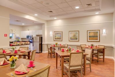 Elegant dining room set for a meal with flowers