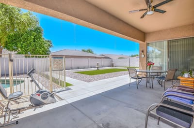 Outdoor patio area with seating and landscaping