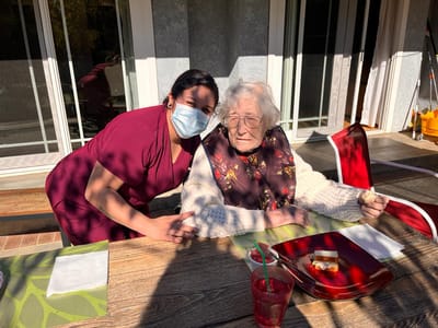 Staff member with a resident enjoying lunch