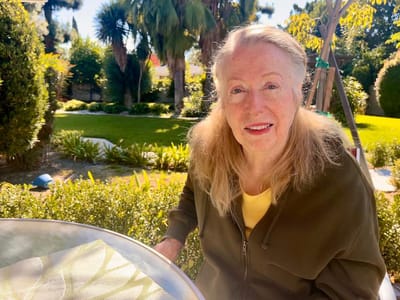 Senior woman enjoying a garden space