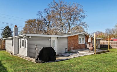 Exterior view of an assisted living home with a patio
