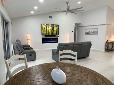 Bright common area with seating and television