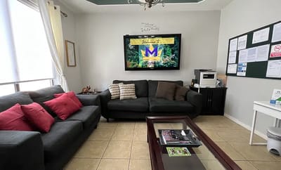 Comfortable lounge area with seating and a TV
