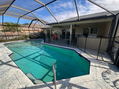 Pool area with patio seating at assisted living facility