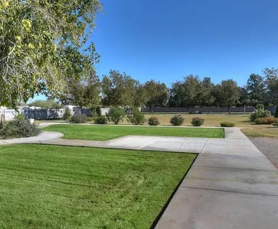 Well-maintained outdoor area with grass and sidewalks
