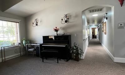 Interior hall with a piano and seating area