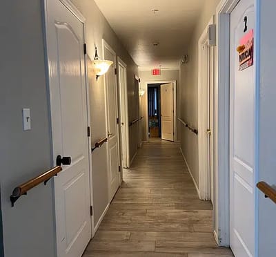 A well-lit hallway in a senior living facility