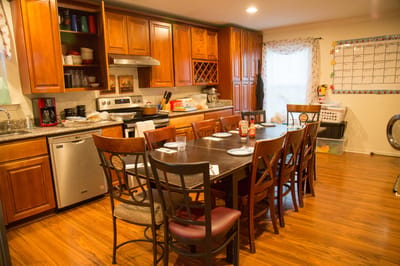 Bright communal kitchen with a large dining table