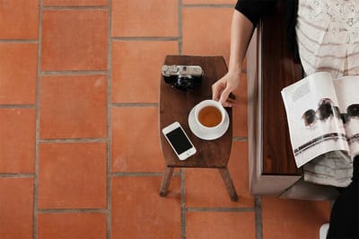 Close-up of a person enjoying tea in an indoor space