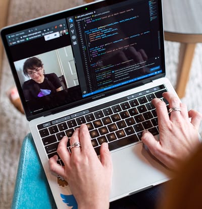 Person video calling on a laptop