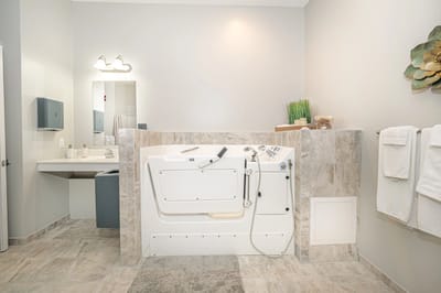 Well-equipped accessible bathroom with tub.