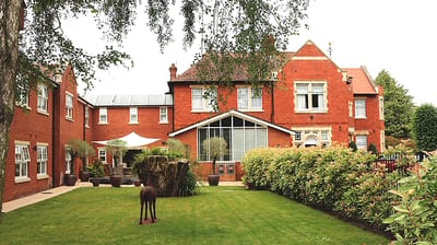 Exterior view of Lyncroft Care Home and garden.