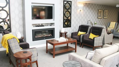 Cozy common area with seating and fireplace