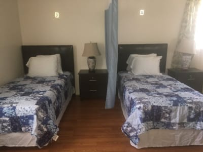 Shared resident bedroom with twin beds.