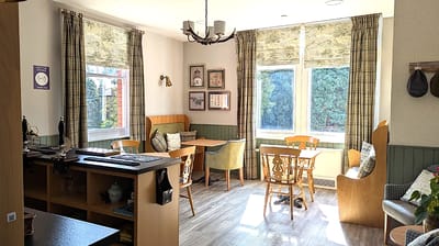 Cozy common area with tables and windows