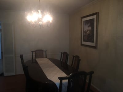 Dining room with a large table and chandelier