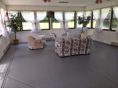 Bright sunroom with seating and plants