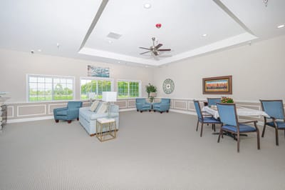 Well-lit common area with seating and dining space.