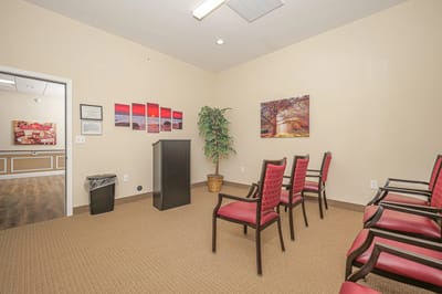 Interior of a meeting room with chairs and decorations.
