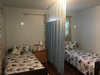 A shared resident bedroom with two beds.