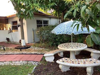 A serene outdoor space with a table and umbrella