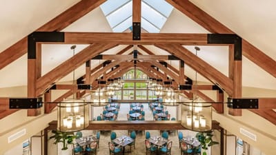 Elegant dining room with wooden beams and natural light