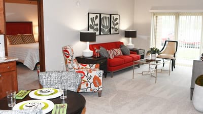 Brightly decorated interior living space of a resident room