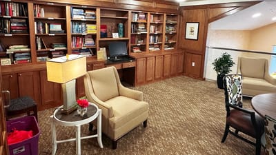 Cozy interior of a common area with bookshelves.