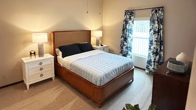 Cozy private bedroom with elegant decor and natural light