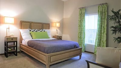 Cozy bedroom with a comfortable bed and natural lighting